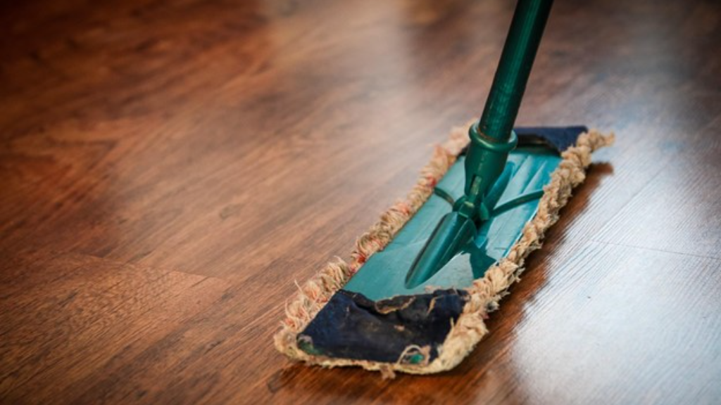 Dry mop on the wood floor.