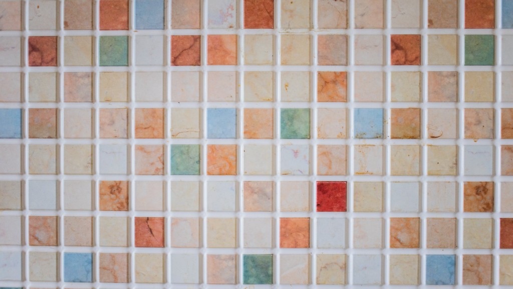Ceramic tiles with grout after cleaning with homemade grout cleaner recipe.